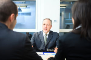 Couple discusses business valuation and divorce in NC with their Raleigh divorce attorney