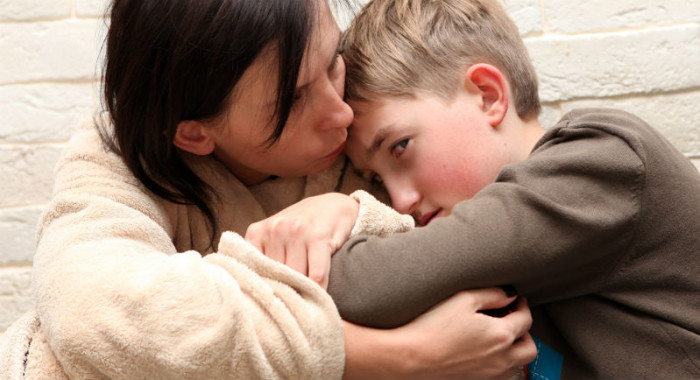 Mother Comforting a child from Abuse
