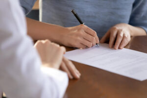 Person signing legal documents for name change after divorce in North Carolina