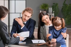 Parents and child meeting with a Raleigh child custody lawyer for a high-conflict custody case