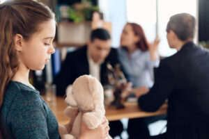 Child custody dispute in North Carolina showing child with parents meeting during custody discussion