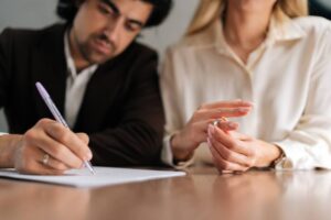 Separating couple reviewing a divorce settlement agreement in Raleigh